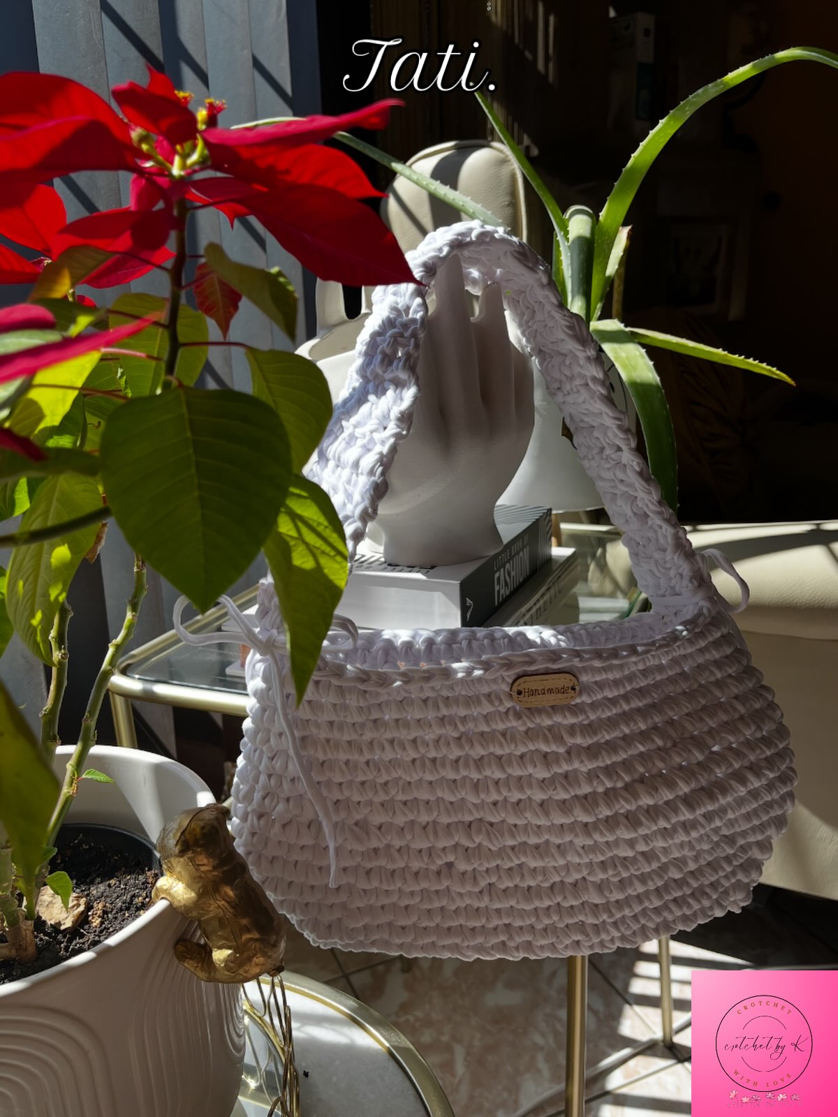 Handmade grey Tati crochet bag in sunlight